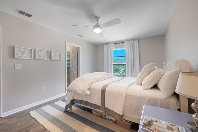 233 Sand Oak Blvd, Panama City Beach, FL 32413 - bedroom featuring wood finished floors, baseboards, and a ceiling fan