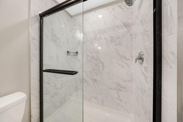 233 Sand Oak Blvd, Panama City Beach, FL 32413 - bathroom with a shower stall and toilet