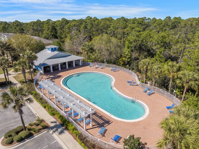 233 Sand Oak Blvd, Panama City Beach, FL 32413 - community pool with a view of trees and a patio area
