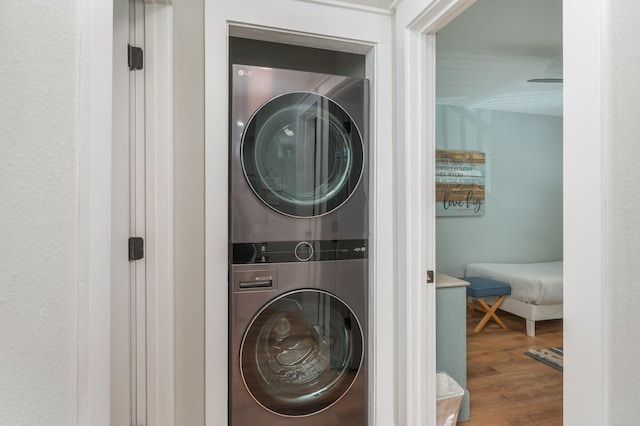 11 Beachside Dr Unit 522, Santa Rosa Beach, FL 32459 - laundry room featuring estacked washer and dryer and wood finished floors