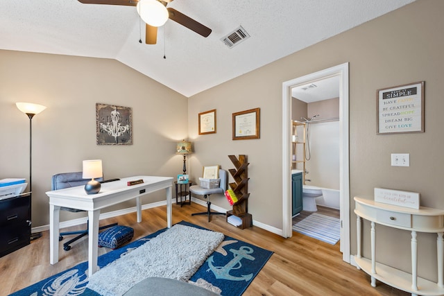 6922 Sea Turtle Cir, Navarre, FL 32566 - office space with ceiling fan, wood finished floors, vaulted ceiling, and baseboards