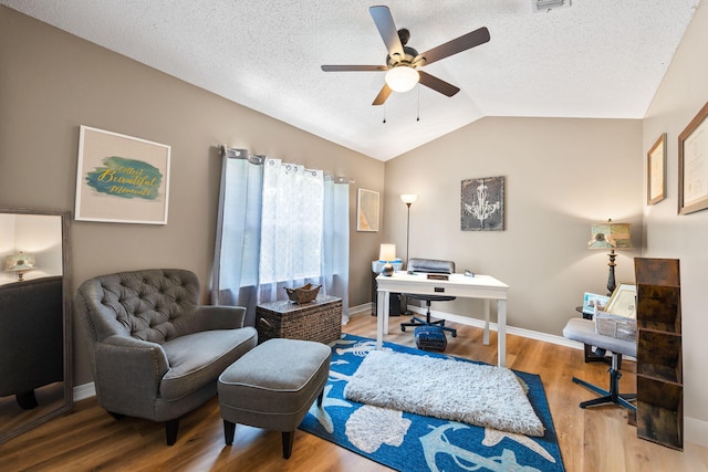6922 Sea Turtle Cir, Navarre, FL 32566 - home office featuring a ceiling fan, wood finished floors, vaulted ceiling, a textured ceiling, and baseboards