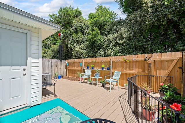 6922 Sea Turtle Cir, Navarre, FL 32566 - wooden deck featuring a fenced backyard