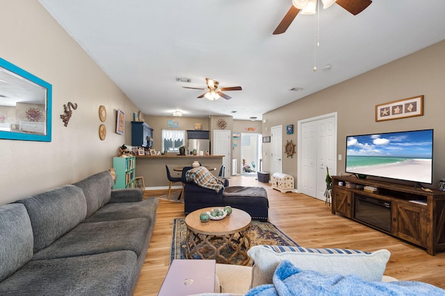 6922 Sea Turtle Cir, Navarre, FL 32566 - living area featuring a ceiling fan and light wood-style flooring
