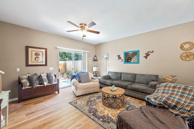 6922 Sea Turtle Cir, Navarre, FL 32566 - living area with a ceiling fan and light wood-style flooring