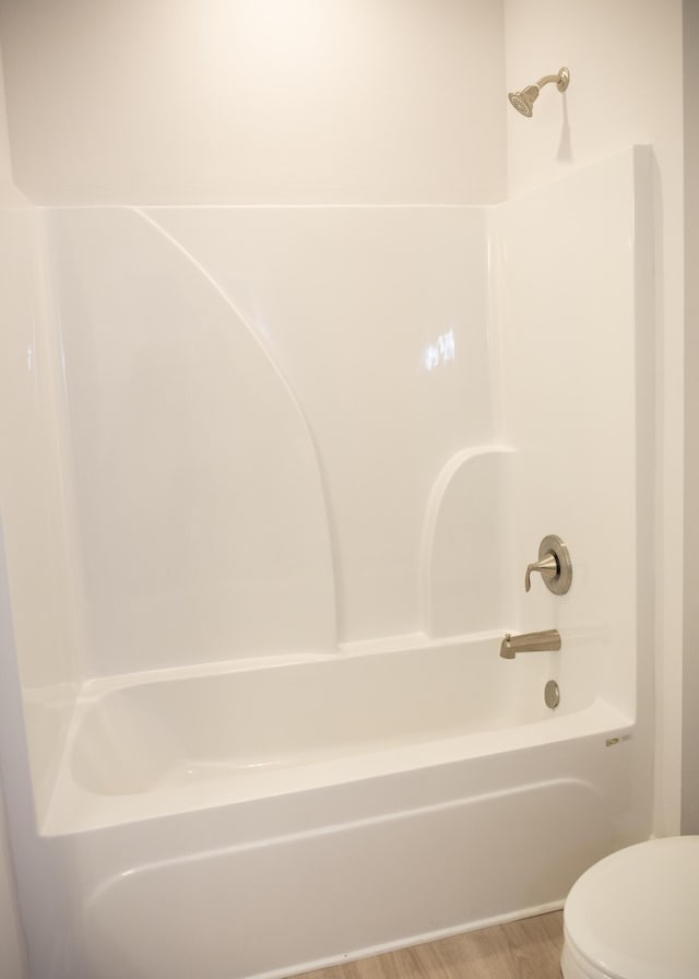 56 Secluded Cir, Freeport, FL 32439 - bathroom featuring shower / washtub combination and wood finished floors