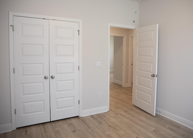 56 Secluded Cir, Freeport, FL 32439 - unfurnished bedroom featuring light wood-style floors and a closet