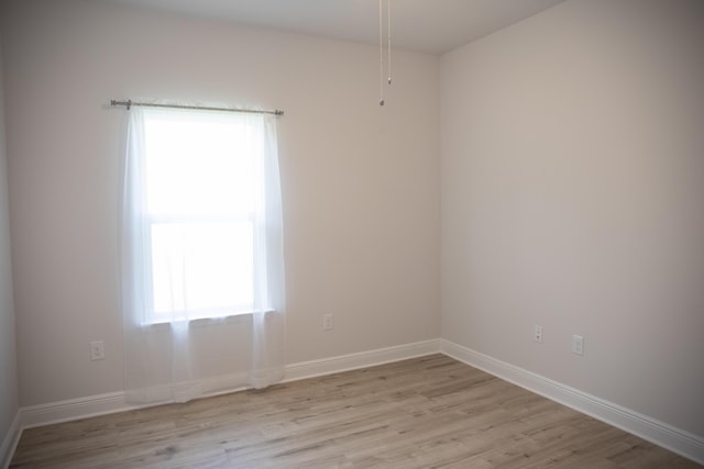 56 Secluded Cir, Freeport, FL 32439 - spare room featuring light wood-style flooring and baseboards