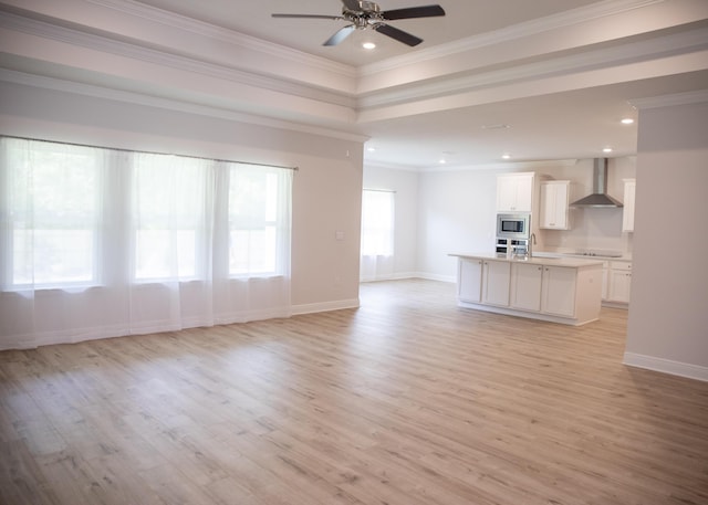 56 Secluded Cir, Freeport, FL 32439 - unfurnished living room with light wood-style flooring, ceiling fan, crown molding, and recessed lighting