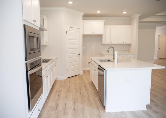 56 Secluded Cir, Freeport, FL 32439 - kitchen with stainless steel appliances, light wood-style flooring, white cabinetry, crown molding, and light countertops