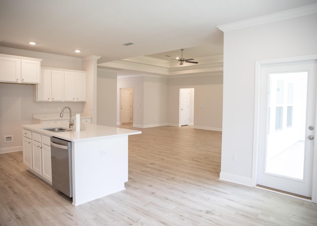 56 Secluded Cir, Freeport, FL 32439 - kitchen with stainless steel dishwasher, ornamental molding, white cabinetry, light wood-style floors, and a kitchen island with sink