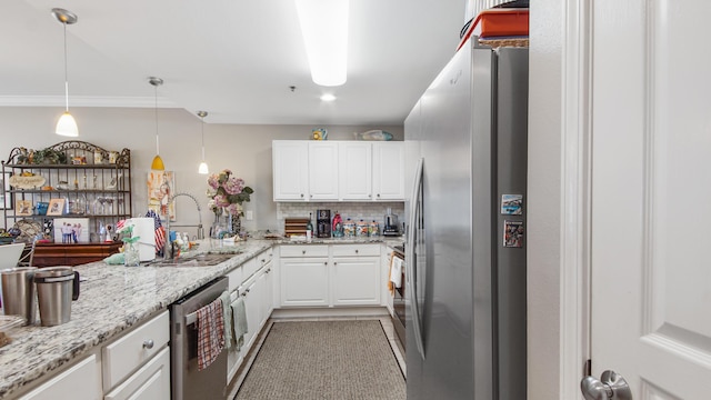 113 SE Brooks St Unit 204, Fort Walton Beach, FL 32548 - kitchen featuring stainless steel appliances, backsplash, white cabinetry, light stone counters, and crown molding