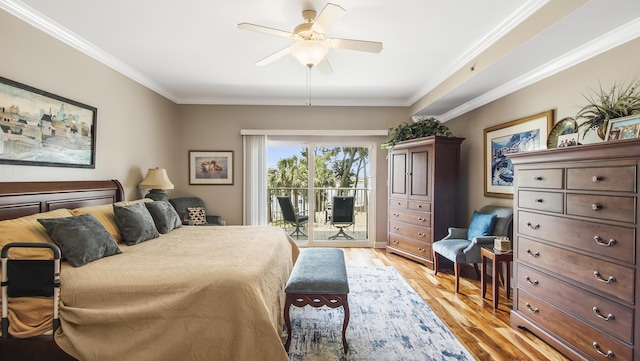 113 SE Brooks St Unit 204, Fort Walton Beach, FL 32548 - bedroom featuring access to outside, crown molding, light wood-type flooring, and ceiling fan
