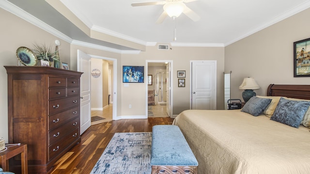 113 SE Brooks St Unit 204, Fort Walton Beach, FL 32548 - bedroom with dark wood-style flooring, ornamental molding, ensuite bath, and ceiling fan