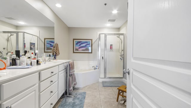 113 SE Brooks St Unit 204, Fort Walton Beach, FL 32548 - bathroom featuring a garden tub, a shower stall, double vanity, tile patterned floors, and recessed lighting