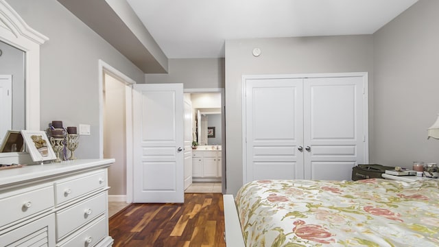 113 SE Brooks St Unit 204, Fort Walton Beach, FL 32548 - bedroom with a closet, dark wood-style flooring, and ensuite bath