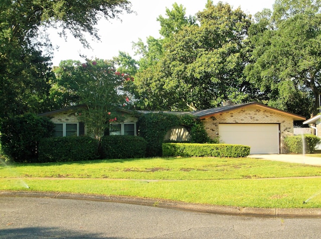 8 NE Carlyle Ct, Fort Walton Beach, FL 32547 - ranch-style house with brick siding, a garage, a front lawn, and driveway