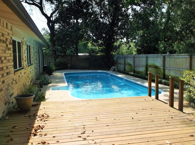 8 NE Carlyle Ct, Fort Walton Beach, FL 32547 - view of swimming pool with a fenced backyard and a deck