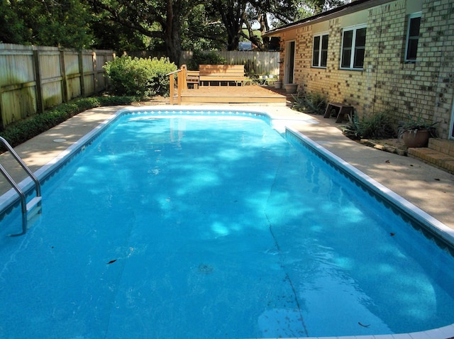 8 NE Carlyle Ct, Fort Walton Beach, FL 32547 - view of pool with a fenced backyard and a deck