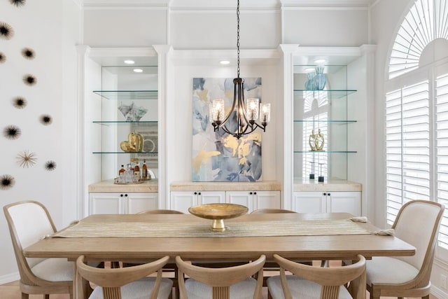 527 Indigo Loop, Miramar Beach, FL 32550 - dining space featuring a chandelier and crown molding