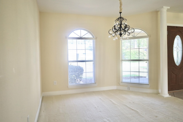 222 Wekiva Cv, Destin, FL 32541 - carpeted foyer featuring plenty of natural light, a chandelier, decorative columns, and baseboards