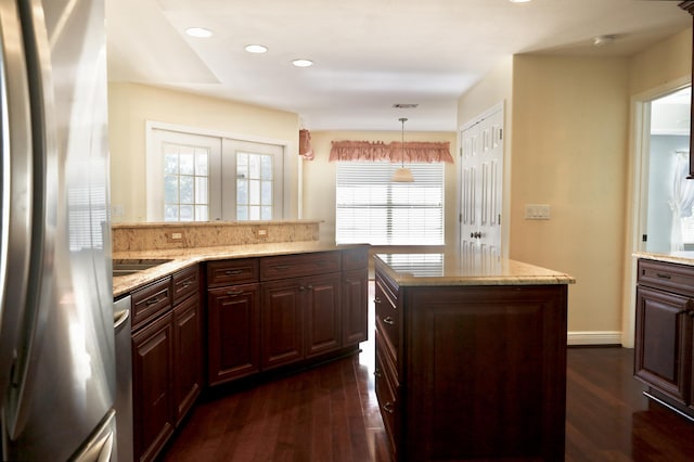 222 Wekiva Cv, Destin, FL 32541 - kitchen with stainless steel appliances, dark wood-style flooring, light stone counters, and recessed lighting