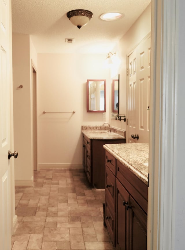 222 Wekiva Cv, Destin, FL 32541 - full bath featuring two vanities and baseboards