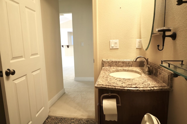222 Wekiva Cv, Destin, FL 32541 - bathroom featuring vanity and baseboards