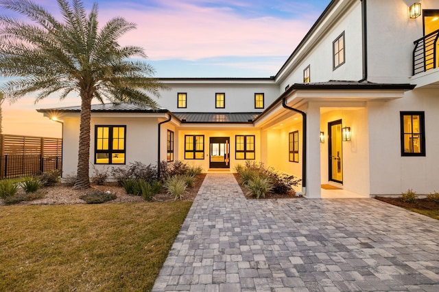253 Driftwood Point Rd, Santa Rosa Beach, FL 32459 - view of front of home featuring stucco siding, a standing seam roof, and metal roof