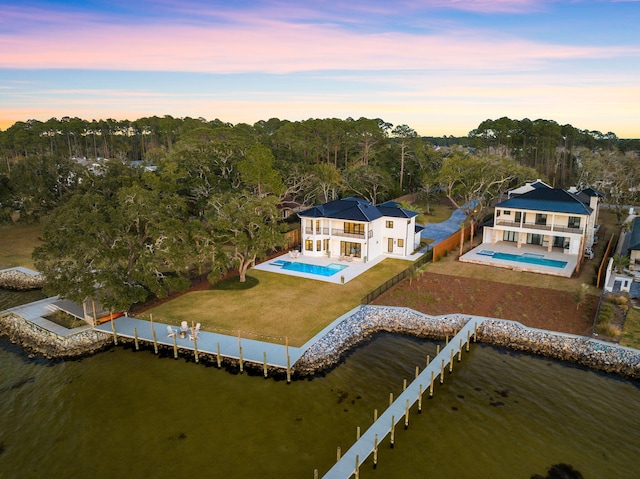 253 Driftwood Point Rd, Santa Rosa Beach, FL 32459 - aerial view at dusk of view of pool, a water view, and a forest view