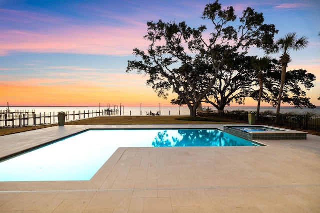 253 Driftwood Point Rd, Santa Rosa Beach, FL 32459 - pool at dusk with a patio, a water view, and a pool with connected hot tub
