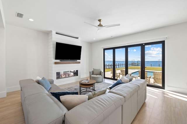 253 Driftwood Point Rd, Santa Rosa Beach, FL 32459 - living area with light wood-style flooring, a large fireplace, ceiling fan, baseboards, and recessed lighting
