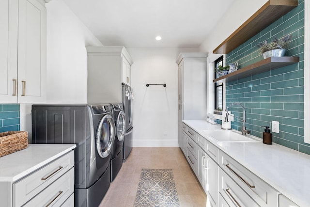 253 Driftwood Point Rd, Santa Rosa Beach, FL 32459 - laundry area with washer and dryer, cabinet space, baseboards, recessed lighting, and light tile patterned floors