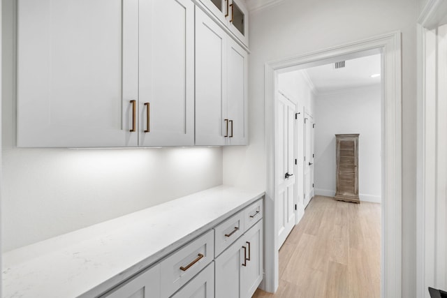 253 Driftwood Point Rd, Santa Rosa Beach, FL 32459 - corridor featuring ornamental molding, light wood-style flooring, and baseboards