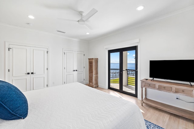 253 Driftwood Point Rd, Santa Rosa Beach, FL 32459 - bedroom featuring access to exterior, ornamental molding, two closets, light wood-style flooring, and baseboards