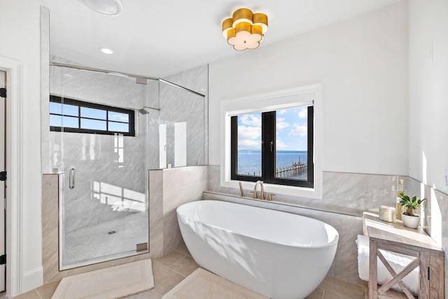 253 Driftwood Point Rd, Santa Rosa Beach, FL 32459 - bathroom with tile walls, a soaking tub, tile patterned floors, a stall shower, and recessed lighting