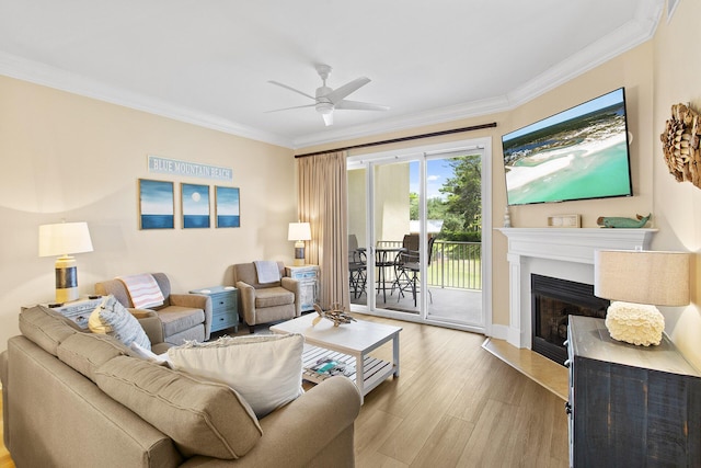 1653 W County Highway 30a Unit 1119, Santa Rosa Beach, FL 32459 - living area featuring ornamental molding, a ceiling fan, a fireplace, and light wood-type flooring
