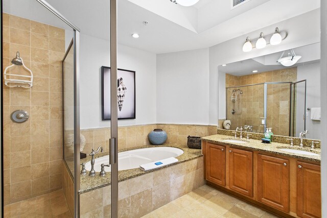 1653 W County Highway 30a Unit 1119, Santa Rosa Beach, FL 32459 - bathroom with a garden tub, a shower stall, double vanity, recessed lighting, and tile patterned floors
