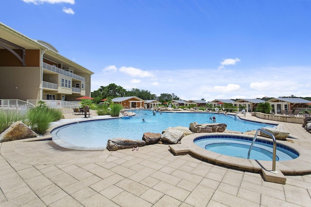1653 W County Highway 30a Unit 1119, Santa Rosa Beach, FL 32459 - community pool featuring a hot tub and a patio