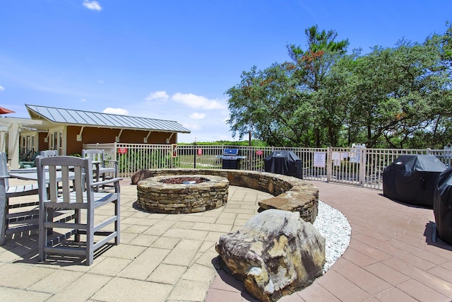 1653 W County Highway 30a Unit 1119, Santa Rosa Beach, FL 32459 - view of patio / terrace featuring an outdoor fire pit and a grill