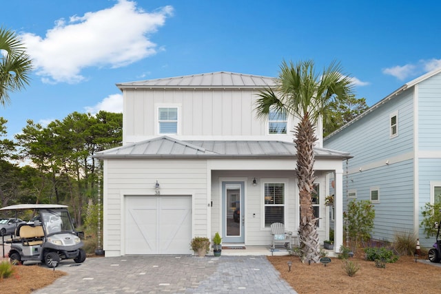 38 Constant Ave, Santa Rosa Beach, FL 32459 - view of front of house with a standing seam roof, metal roof, board and batten siding, and decorative driveway