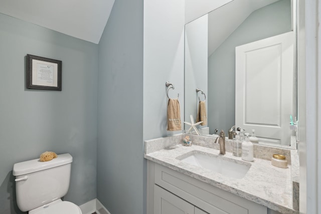 38 Constant Ave, Santa Rosa Beach, FL 32459 - bathroom with lofted ceiling, toilet, and vanity