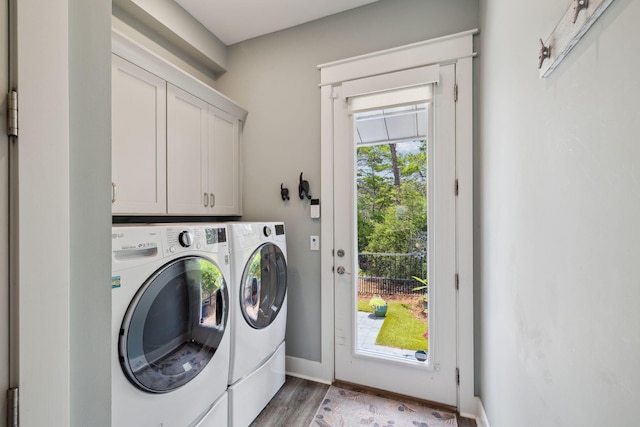 38 Constant Ave, Santa Rosa Beach, FL 32459 - laundry area with washing machine and dryer, cabinet space, baseboards, and light wood-style floors