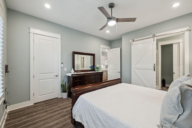 38 Constant Ave, Santa Rosa Beach, FL 32459 - bedroom featuring dark wood-type flooring, recessed lighting, baseboards, a barn door, and ceiling fan