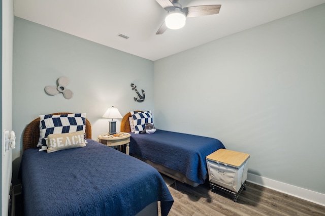 38 Constant Ave, Santa Rosa Beach, FL 32459 - bedroom with wood finished floors, ceiling fan, and baseboards