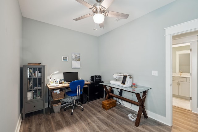 38 Constant Ave, Santa Rosa Beach, FL 32459 - office featuring wood finished floors, a ceiling fan, baseboards, and a sink