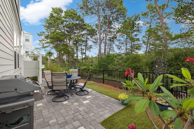 38 Constant Ave, Santa Rosa Beach, FL 32459 - view of patio featuring outdoor dining area and a grill