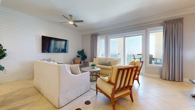 11807 Front Beach Rd Unit 1- 2204, Panama City Beach, FL 32407 - living area featuring ornamental molding, ceiling fan, light tile patterned floors, and wooden walls