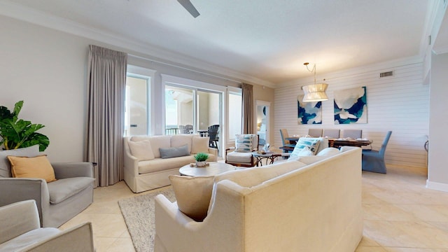11807 Front Beach Rd Unit 1- 2204, Panama City Beach, FL 32407 - living room with crown molding, wooden walls, light tile patterned floors, and ceiling fan