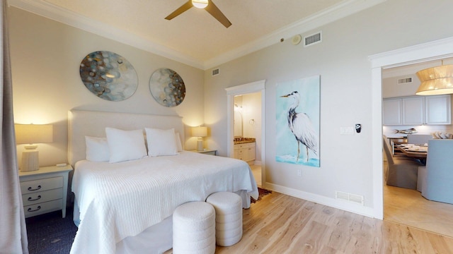 11807 Front Beach Rd Unit 1- 2204, Panama City Beach, FL 32407 - bedroom with crown molding, light wood-style floors, ensuite bathroom, a ceiling fan, and baseboards